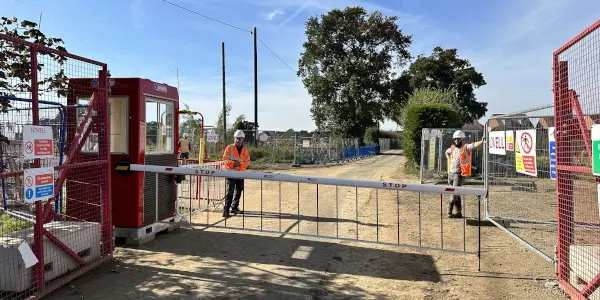 SOSEC 600 on cocnstruction site barrier with cab.