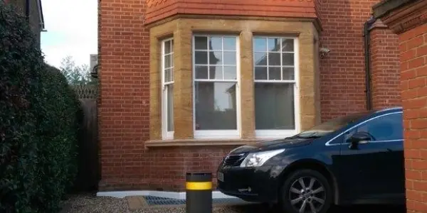 single bollard on residential driveway.